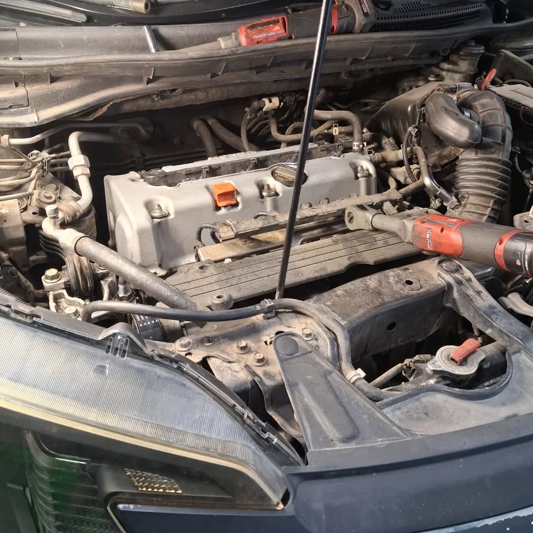 Engine bay inspection in progress at Brothers Garage